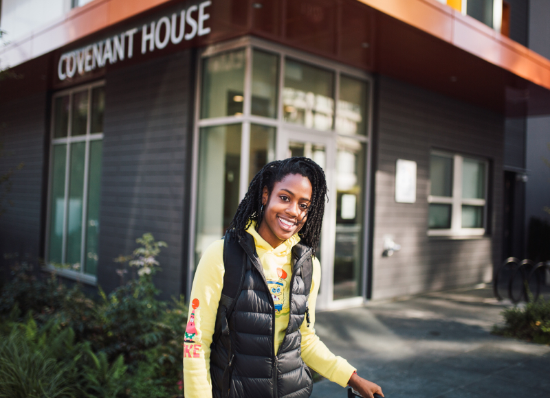 youth standing in front of Covenant House location smiling