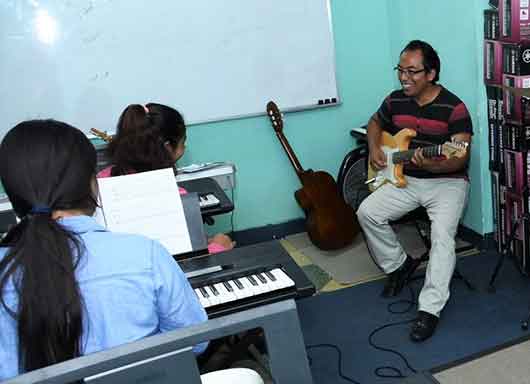 Esteban Monroy in the Covenant House Guatemala Music Room