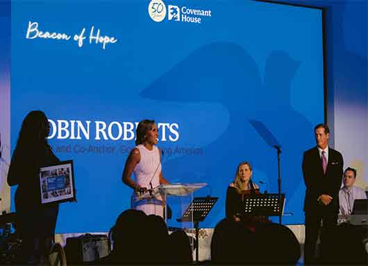 robin roberts on stage at night of covenant house stars gala 2022